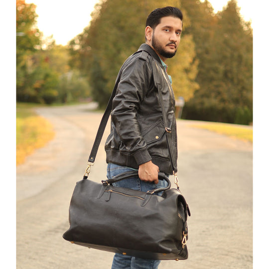 Duffy's black leather travel duffel bag