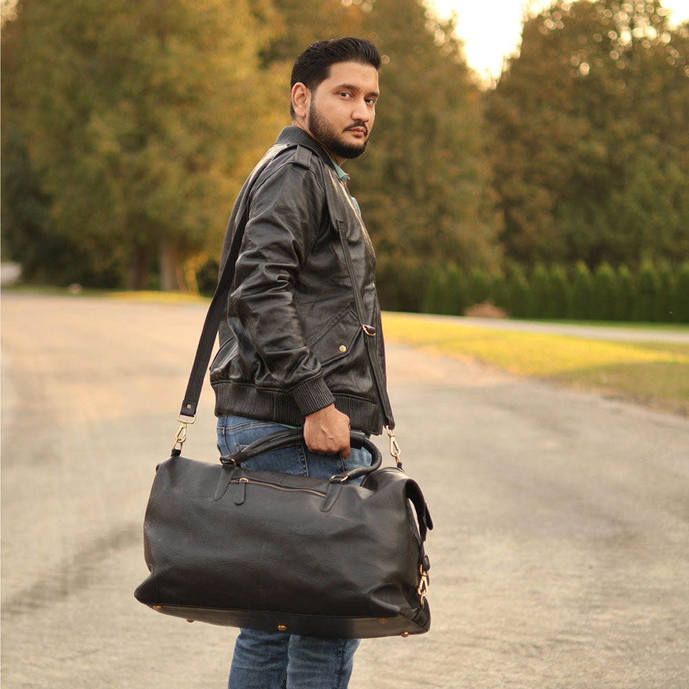 Duffy's black leather travel duffel bag