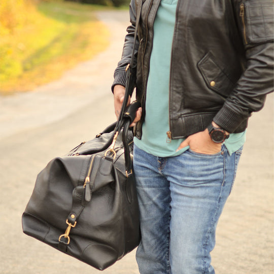 Duffy's black leather travel duffel bag