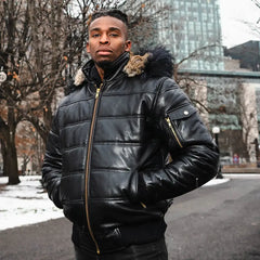A model wearing the Ash hooded leather puffer jacket with a streetwear outfit, showcasing the urban aesthetic and mid-weight volume.