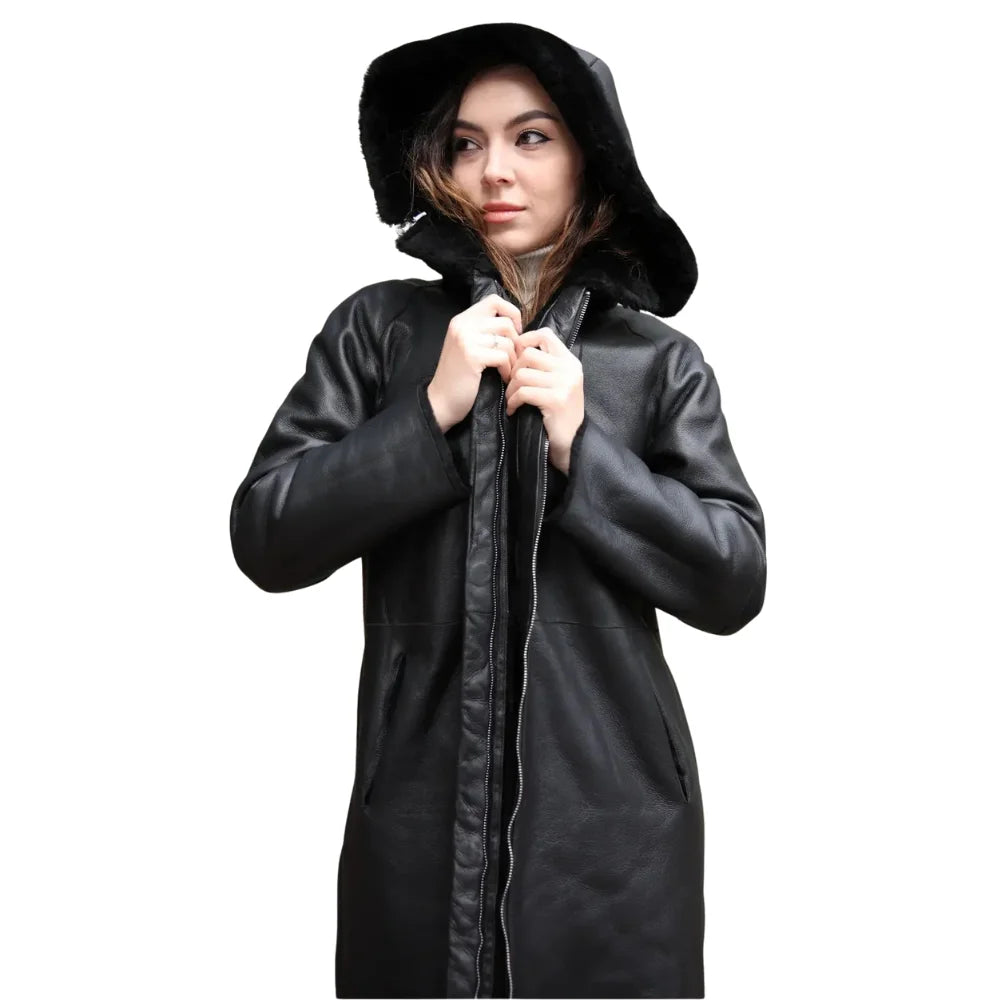 Model wearing the Avalon Black oversized reversible sheepskin long coat, styled for a fashionable and cozy winter look with its versatile and oversized design.