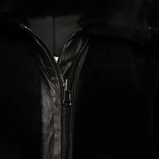 Zipper Close-up of the Avalon Black oversized reversible sheepskin long coat, featuring high-quality stitching, a plush collar