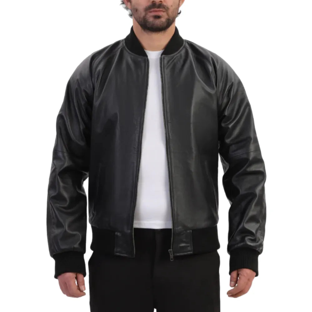 Model wearing black bomber style ribbed leather jacket with ribbed cuffs and waistband