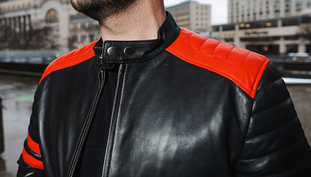 Black moto style jacket with shoulder and arm patches