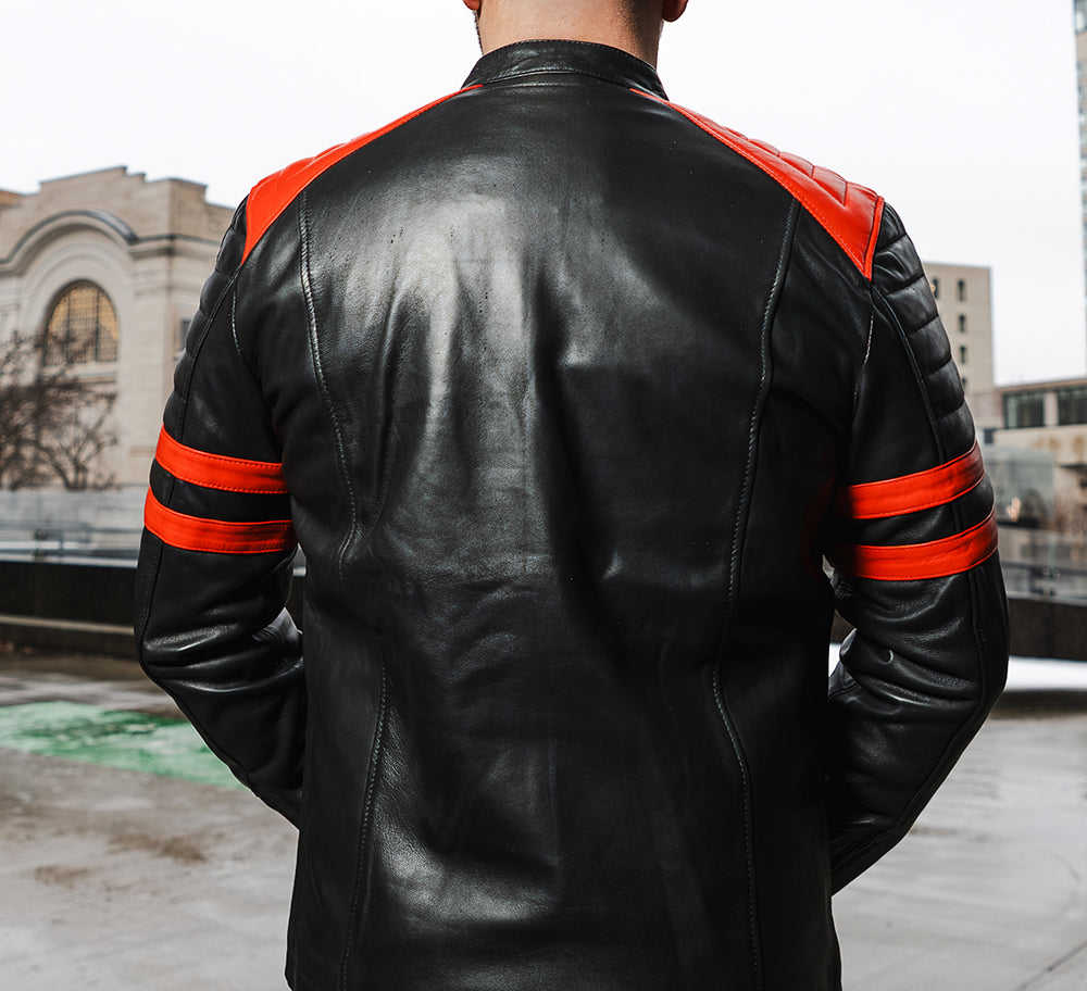 Black moto style jacket with shoulder and arm patches