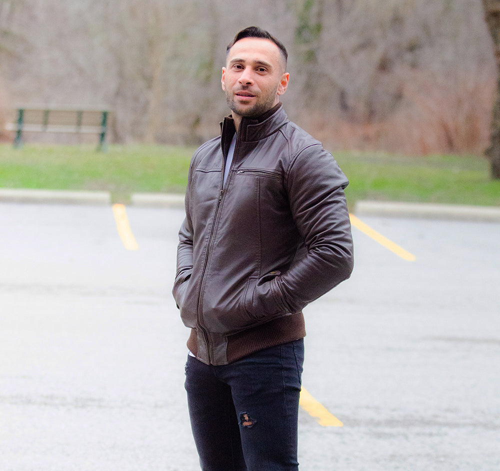 Brown leather jacket with straight ribbed collar, cuffs and hem