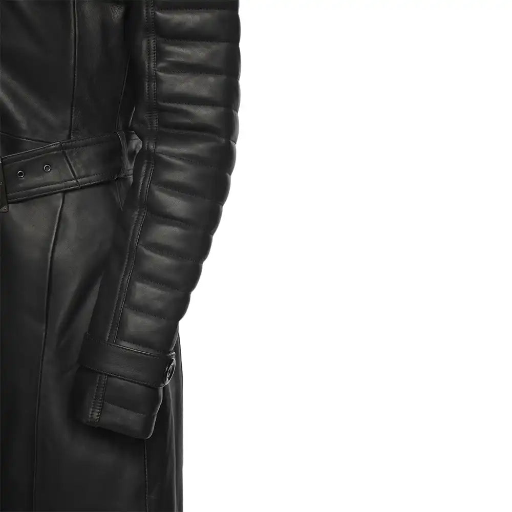 Close-up of a black leather trench coat with quilted sleeves on a white background