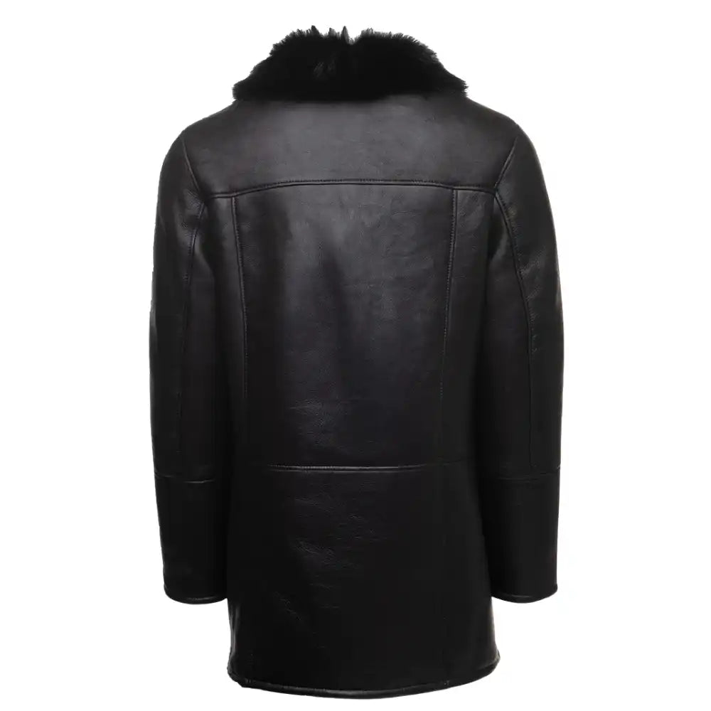 Back view of the black shearling trench coat highlighting the smooth leather exterior and longline tailored fit.