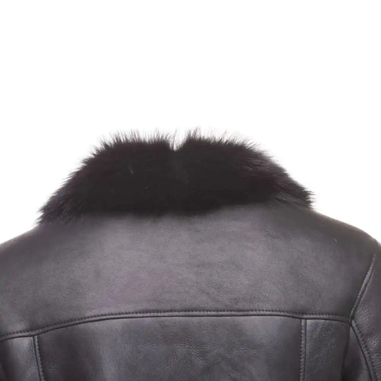 Rear Close-up of Black shearling trench coat with fur collar on a white background.