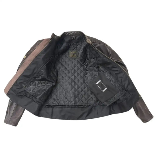 Close-up of the interior classic snap-tab mandarin collar and the aged-brass hardware typical of a brown cafe racer.