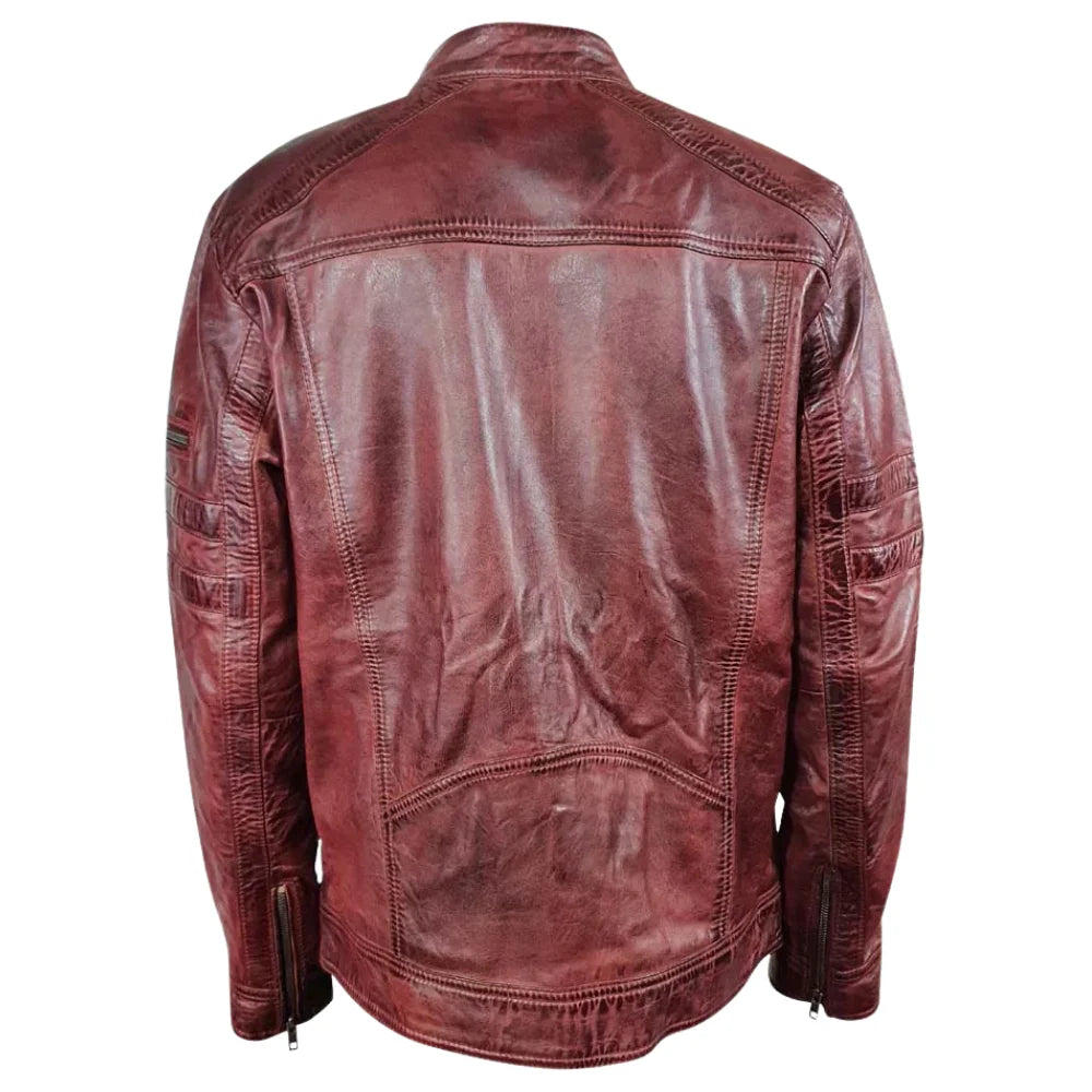 Rear view of Charley Ellwood’s burnished burgundy leather moto jacket showing the hand-finished leather texture and paneling on a white background.