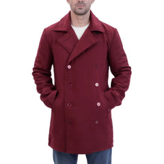 burgundy wool overcoat worn by a person hands in pocket on a white background