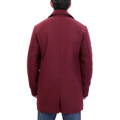 Man wearing a burgundy wool overcoat with a rear view on a white background