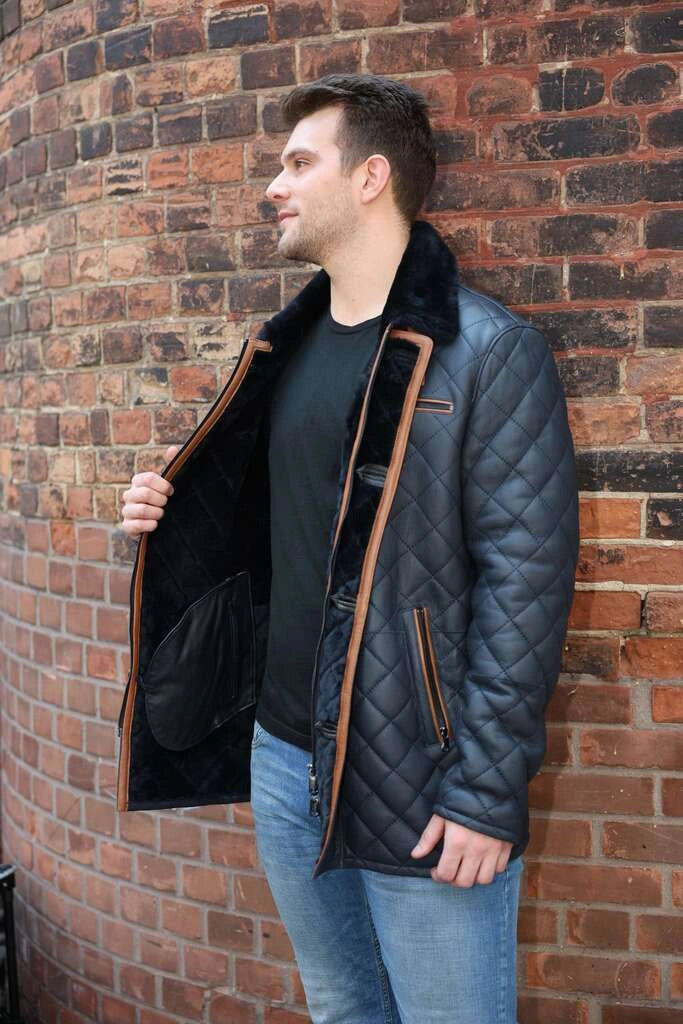 Model wearing Drew Navy Quilted Sheepskin Shearling Coat navy winter coat