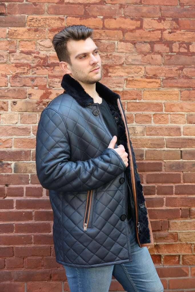 Side profile model wearing Drew Navy Quilted Sheepskin Shearling Coat