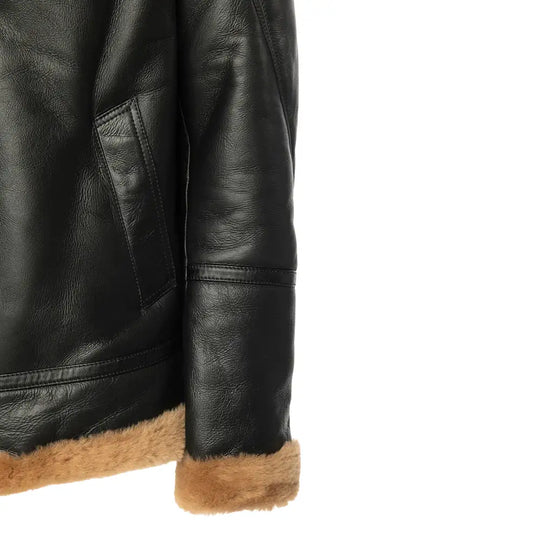 Detailed view of Slanted hand pockets on the black Aviator bomber shearling jacket