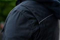 Close-up of the air-ventilation system, highlighting the zippered mesh intakes on the chest and perforated leather panels.