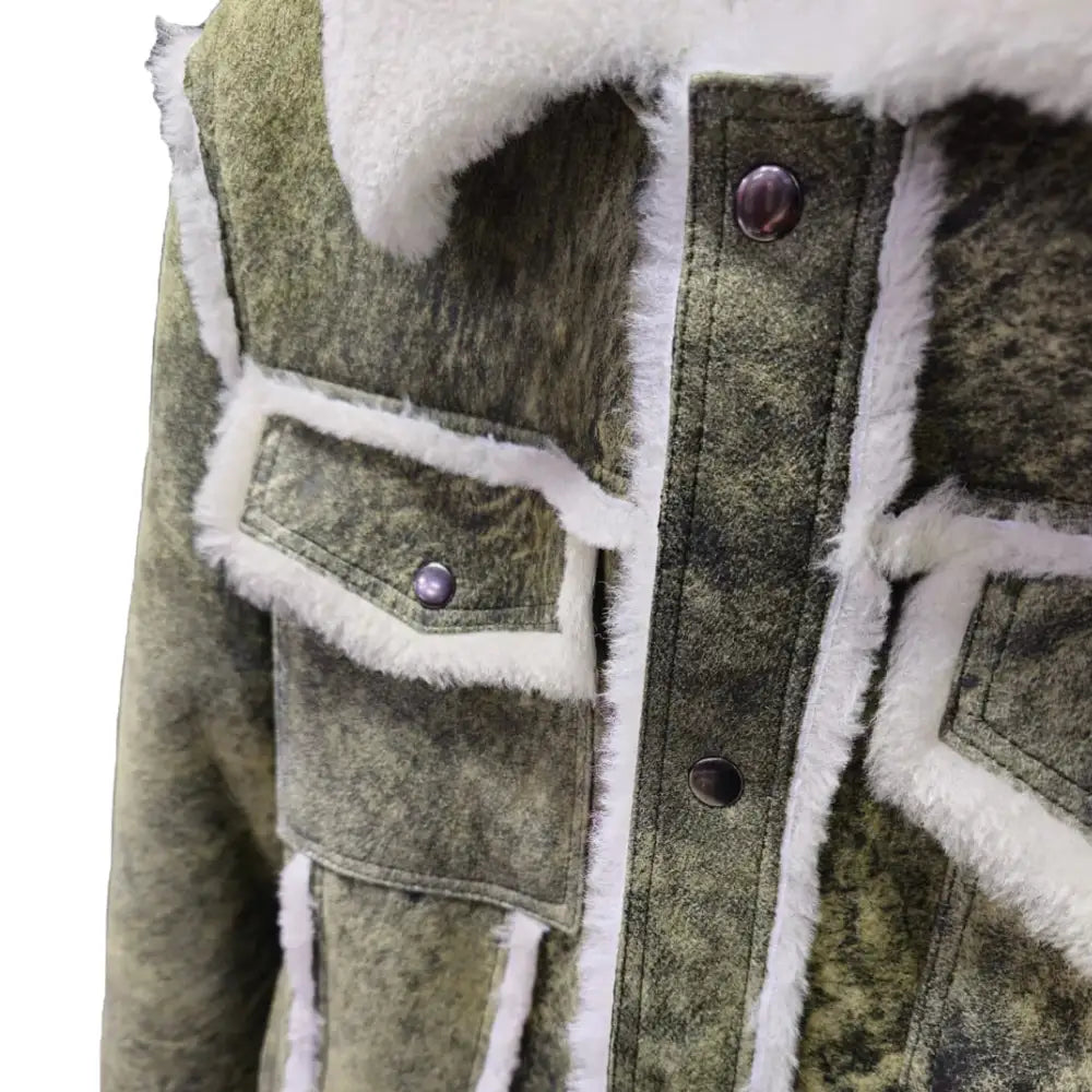 Close-up of Hudson's Green Trucker Shearling Jacket highlighting the flap pockets and shearling trim around the collar.