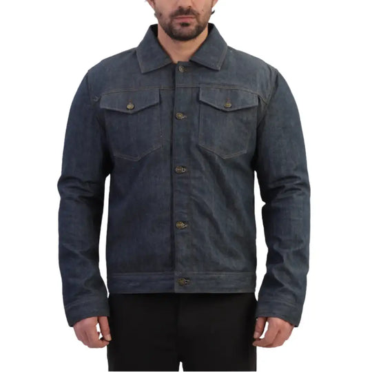 A male model wearing the Julian armored blue denim leather motorcycle jacket, paired with riding jeans and boots, standing in a confident three-quarter pose.