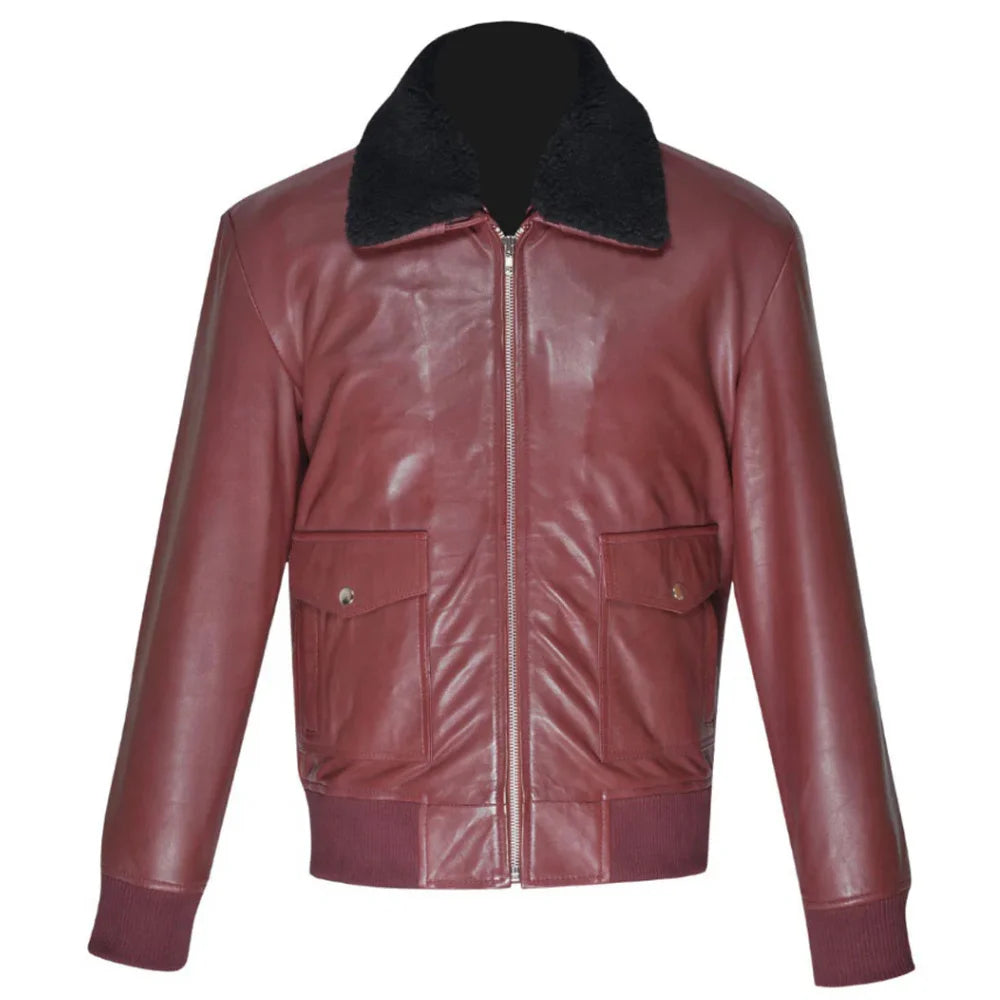 Front view of Justin's burgundy A2 bomber leather jacket featuring a black faux fur collar, ribbed waistband, and large snap-flap patch pockets on a white background.