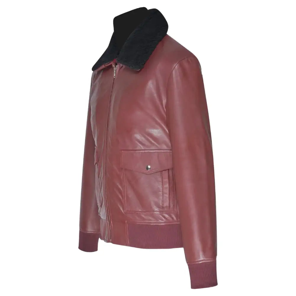 Side profile of Justin's Burgundy A2 Bomber leather jacket, highlighting its sleek design with ribbed knit cuffs and a shirt-style collar.