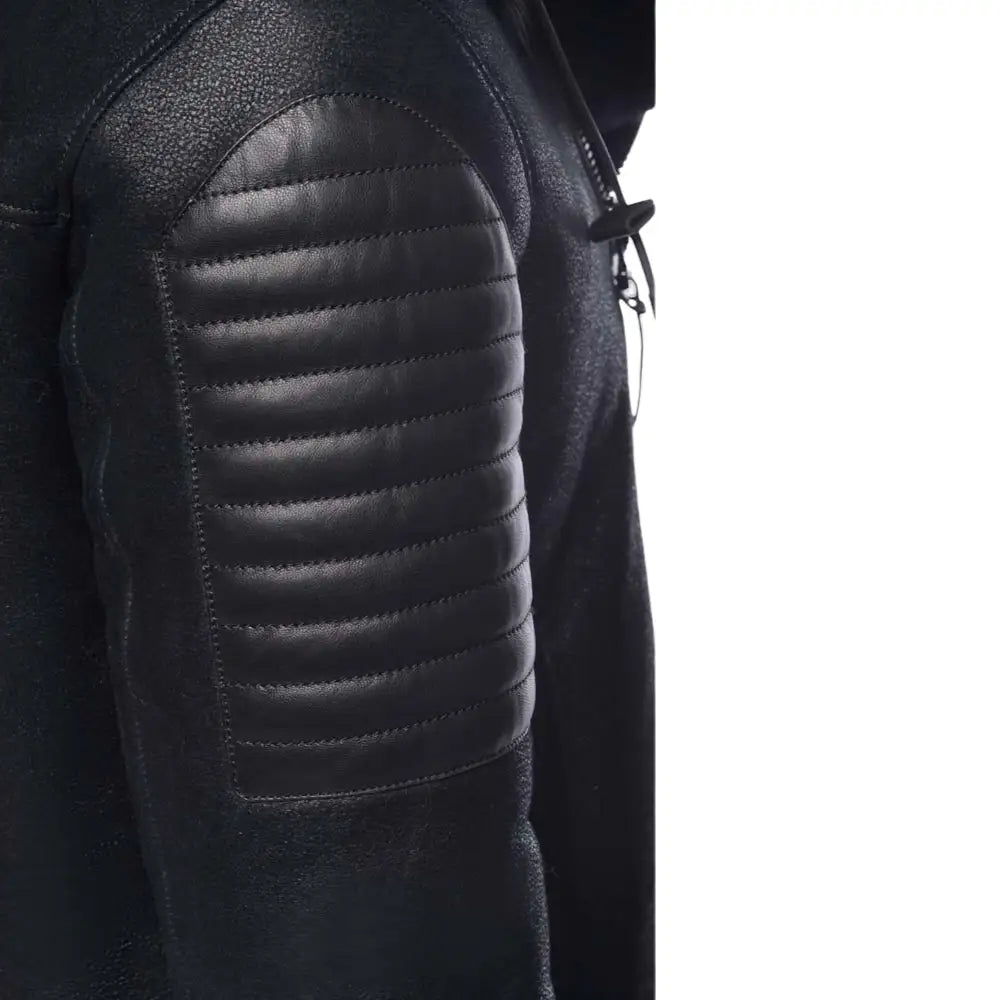 Black jacket with quilted shoulder design on a white background
