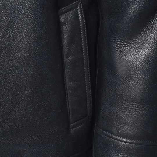 Detailed view of the pockets on the Lucas Black Aviator Bomber Shearling Jacket with Hoodie, designed for convenience and added style.