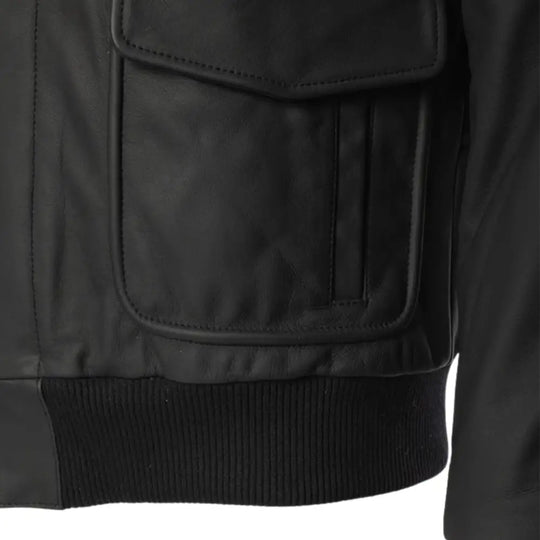 Close-up of the dual flap pockets on the matte black A2 bomber leather jacket.