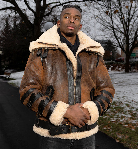Model wearing Richard's Vintage Distressed Brown Aviator Bomber Shearling Jacket outdoors, showcasing the bold distressed leather design with shearling lining and adjustable straps.