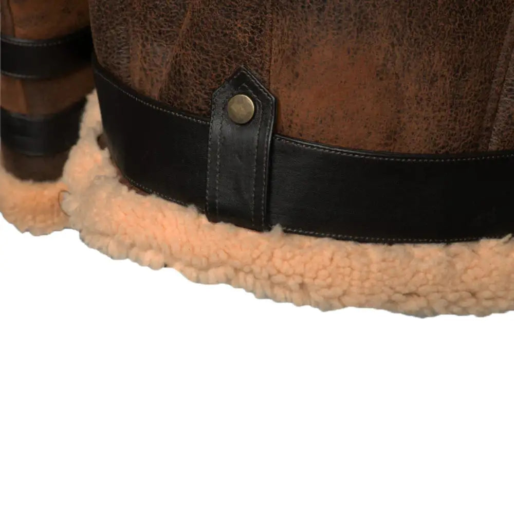 Close-up view of the waist belt buckle and distressed leather straps on Richard's Vintage Distressed Brown Aviator Bomber Shearling Jacket, highlighting its rugged design.