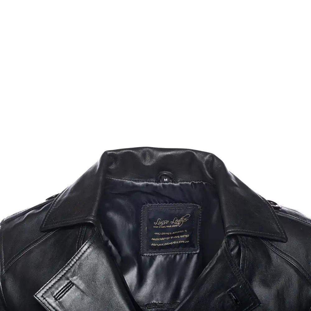 Close-up of a black leather coat collar with a brand label on a white background