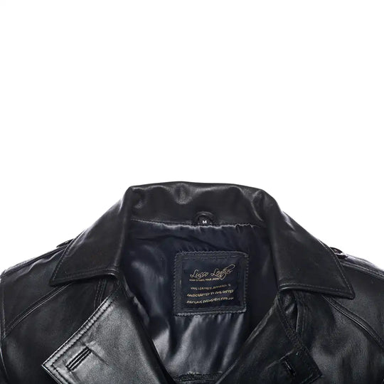 Close-up of a black leather coat collar with a brand label on a white background