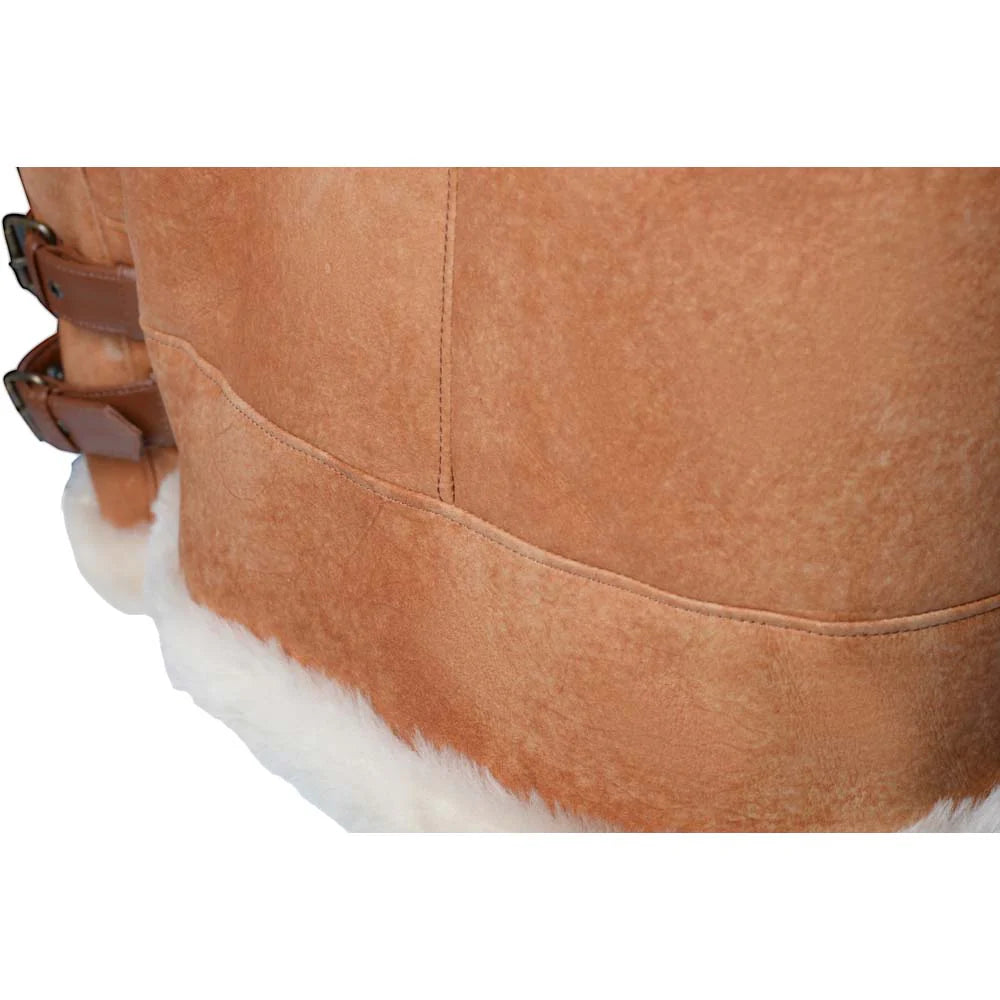 Close-up of a Cognac shearling aviator jacket with white fur lining on a white background.