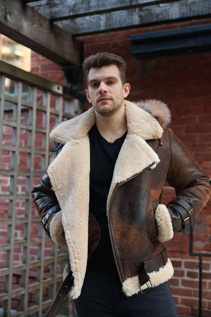 Man wearing Rocco vintage brown aviator shearling jacket with fur lining in an urban setting.