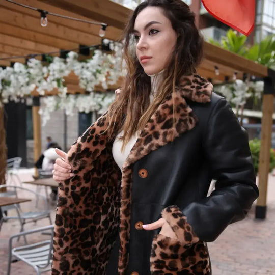 Side profile model wearing Seraphina Leopard Print Oversized Double Breasted Shearling Leather Coat oversized fit