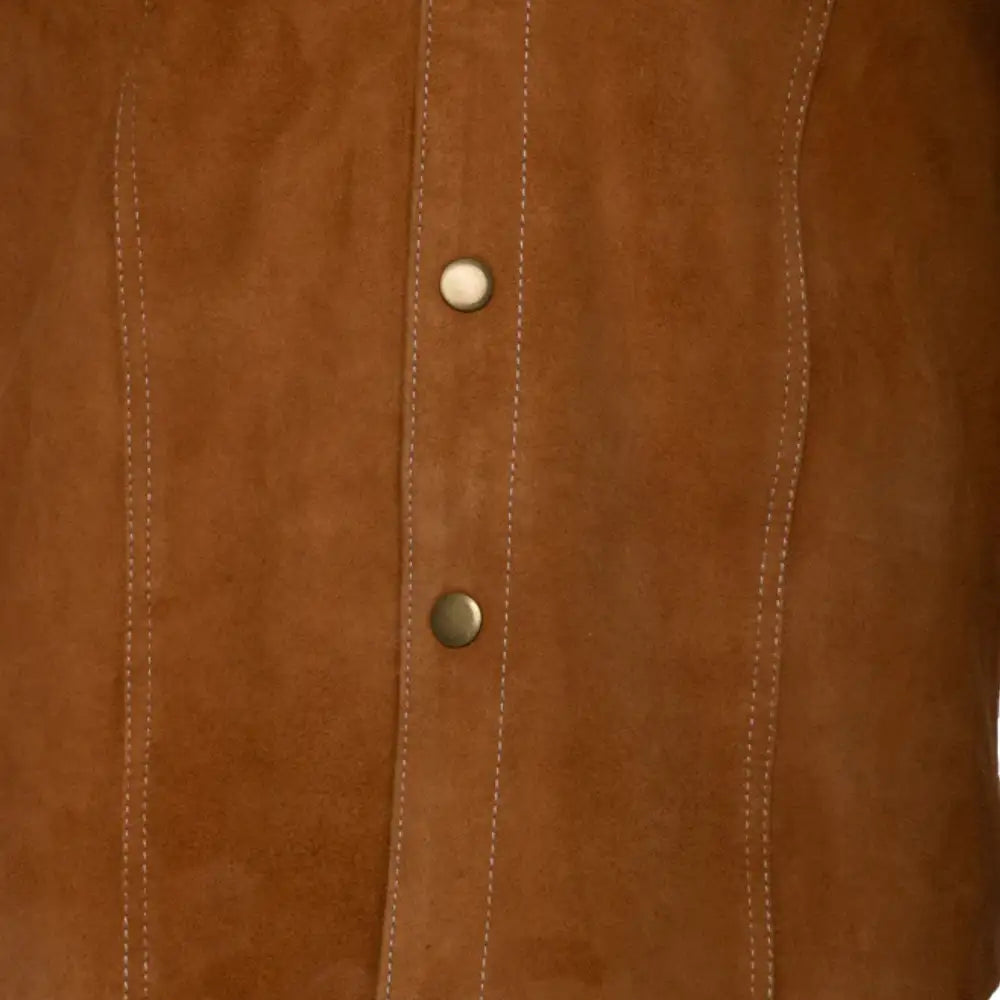 Close-up of a tan suede leather jacket with button details