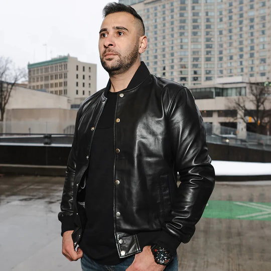 Model side view wearing Victor Black Varsity Leather Jacket