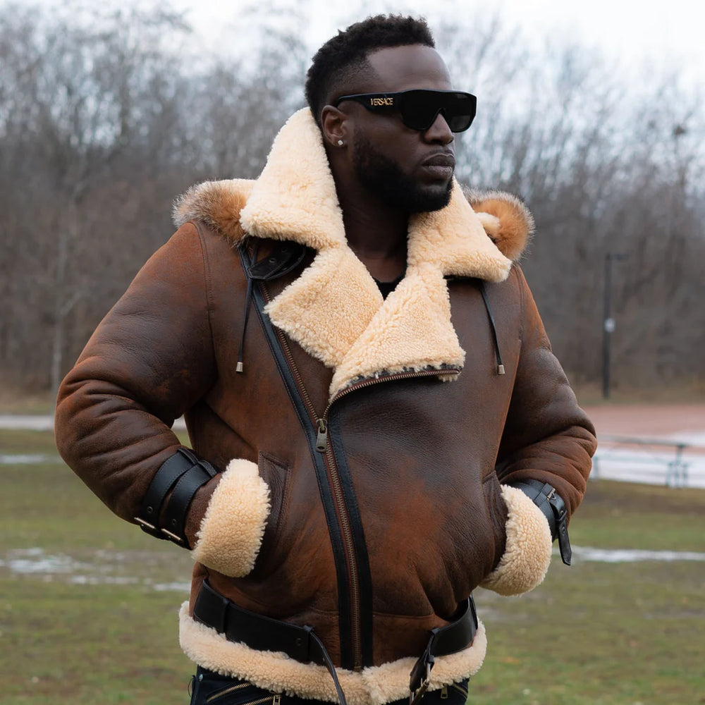Lifestyle photoshoot of a man wearing Rocco vintage brown aviator shearling jacket featuring a classic cream shearling collar in an outdoor setting.